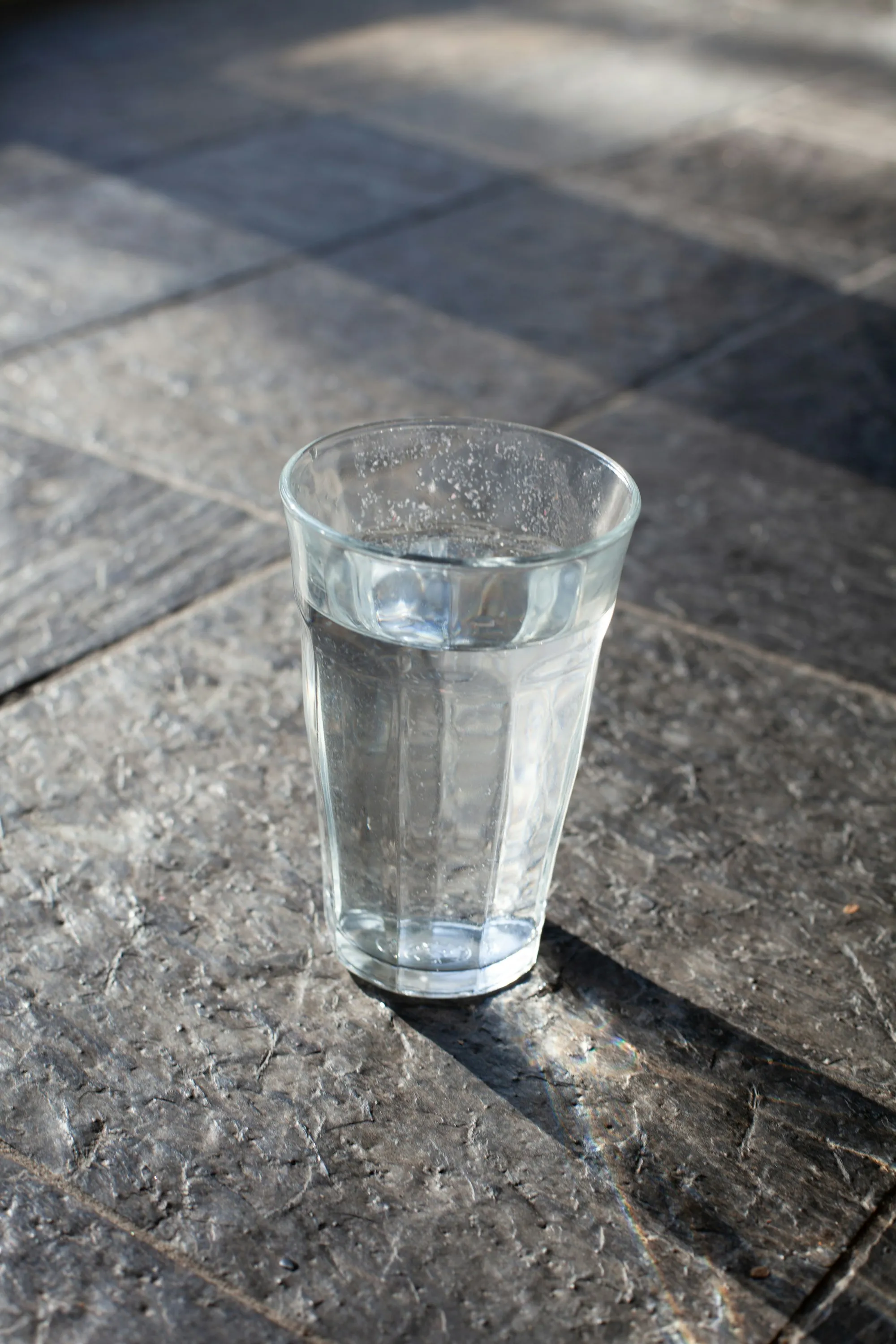The Newport Beach Water Pros Blog Glass of clear drinking water on a marble table