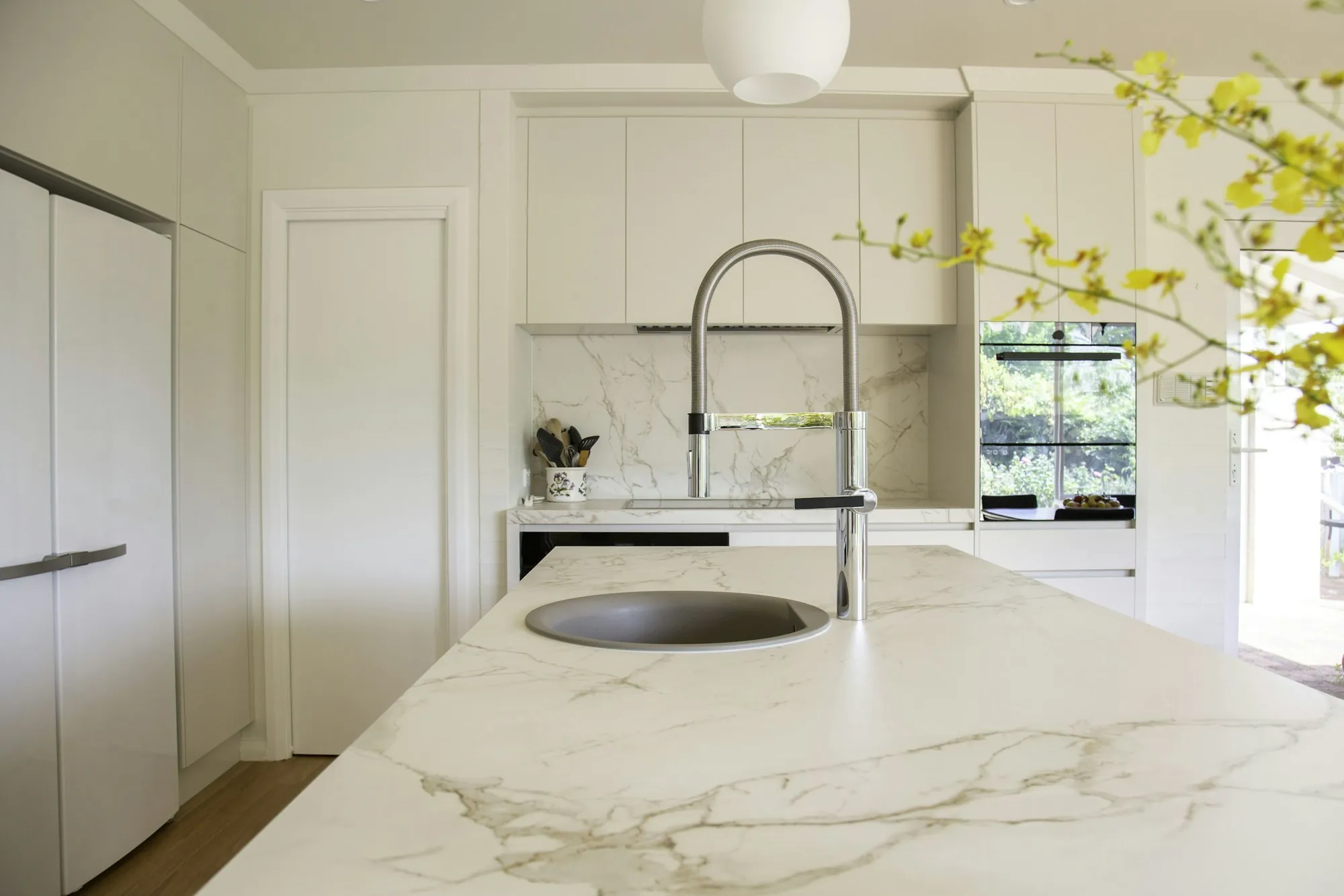 Stainless steel faucet over a kitchen sink