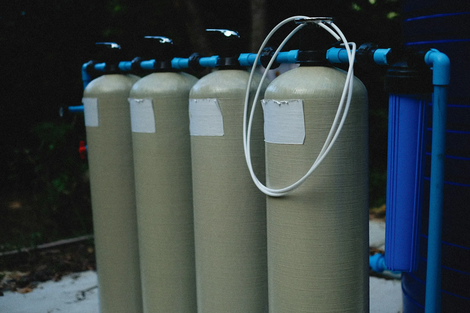 Testing First, Always Row of water filtration tanks connected with tubing