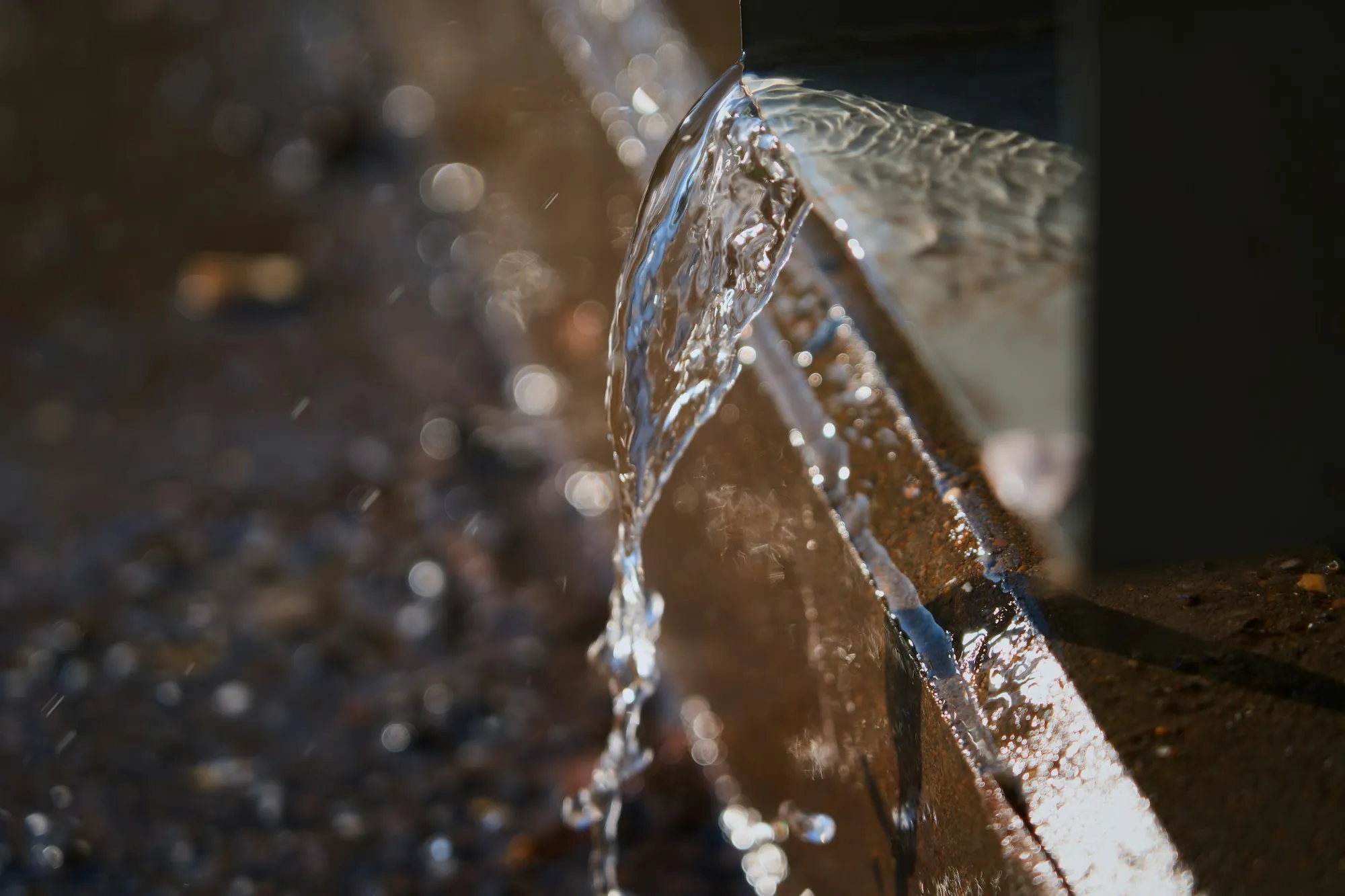 Sediment Filtration in Newport Beach Water spraying from a pipe onto the ground