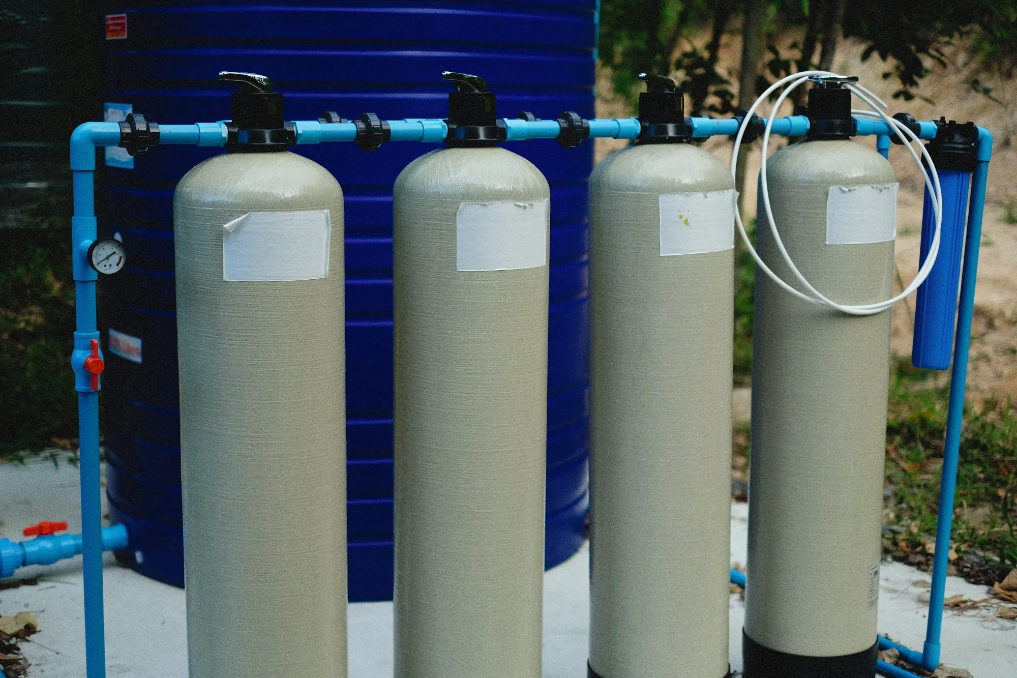Whole-House Water Filtration in Newport Beach Two whole-house water filtration tanks side by side